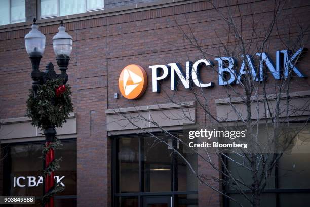 Signage is displayed at a PNC Financial Services Group Inc. Bank branch in downtown Chicago, Illinois, U.S., on Monday, Jan. 8, 2018. PNC Financial...