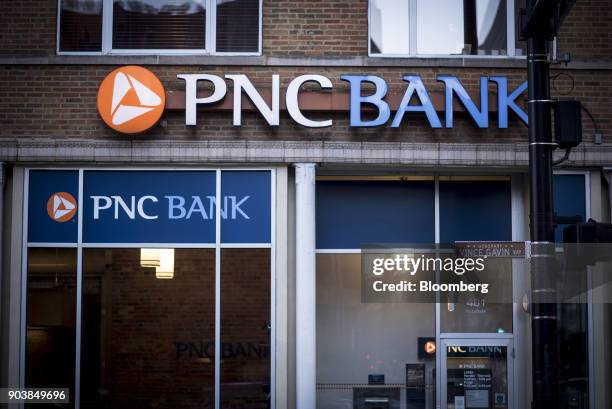Signage is displayed outside a PNC Financial Services Group Inc. Bank branch in downtown Chicago, Illinois, U.S., on Monday, Jan. 8, 2018. PNC...