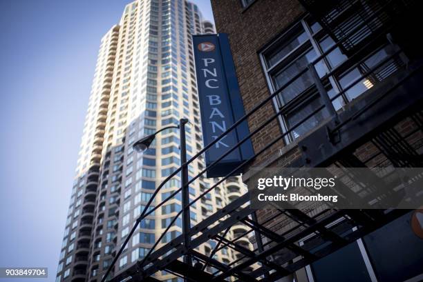Signage is displayed at a PNC Financial Services Group Inc. Bank branch in downtown Chicago, Illinois, U.S., on Monday, Jan. 8, 2018. PNC Financial...