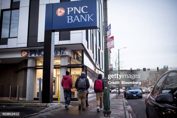 Pedestrians pass in front of a PNC Financial Services Group Inc. Bank branch in downtown Chicago, Illinois, U.S., on Tuesday, Jan. 9, 2018. PNC...