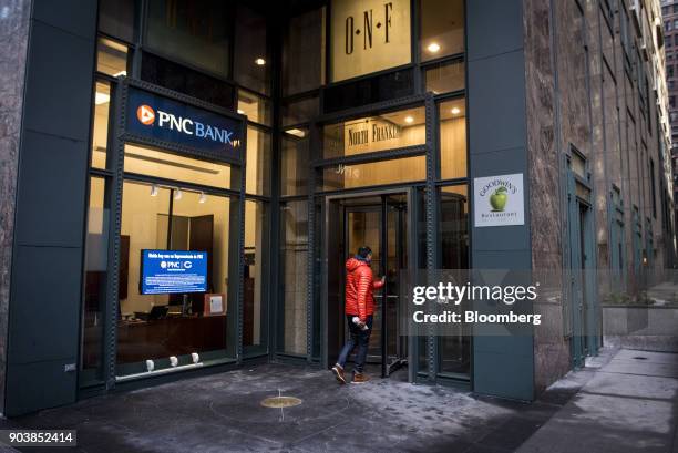 Customer enters a PNC Financial Services Group Inc. Bank branch in downtown Chicago, Illinois, U.S., on Tuesday, Jan. 9, 2018. PNC Financial Services...