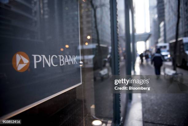 Signage is displayed at a PNC Financial Services Group Inc. Bank branch in downtown Chicago, Illinois, U.S., on Tuesday, Jan. 9, 2018. PNC Financial...