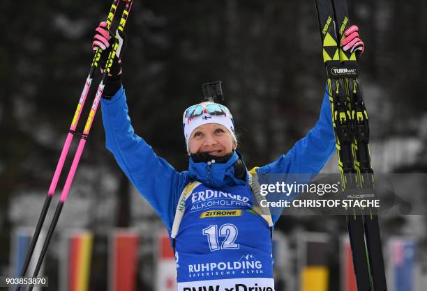 Finland's Kaisa Makarainen celebrates after finishing third in the women's 15 km individual event at the Biathlon World Cup on January 11, 2018 in...