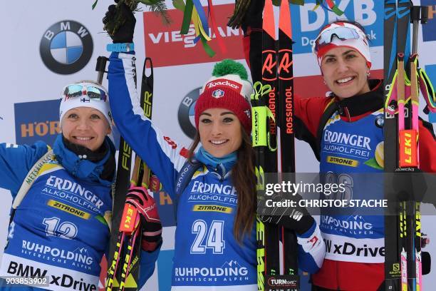 Finland's Kaisa Makarainen, Italy's Dorothea Wierer and Canada's Rosanna Crawford celebrate on the podium after the women's 15 km individual event at...