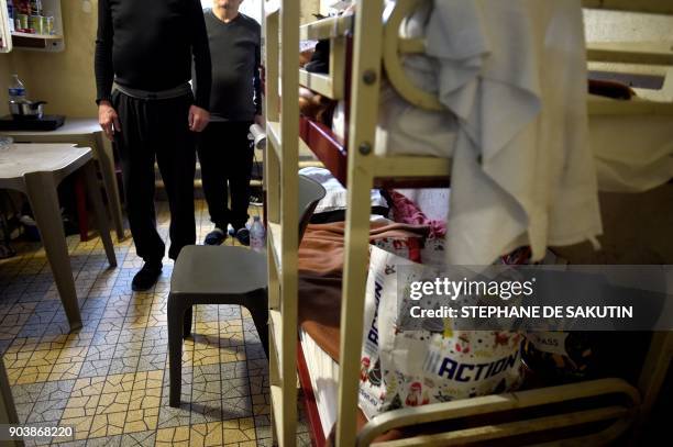 Picture taken on January 11, 2018 shows two inmates in a cell at the Fresnes prison in Fresnes.