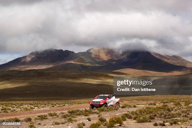 Giniel De Villiers of South Africa and Toyota Gazoo Racing drives with co-driver Dirk Von Zitzewitz of Germany in the Hilux Toyota car in the Classe...