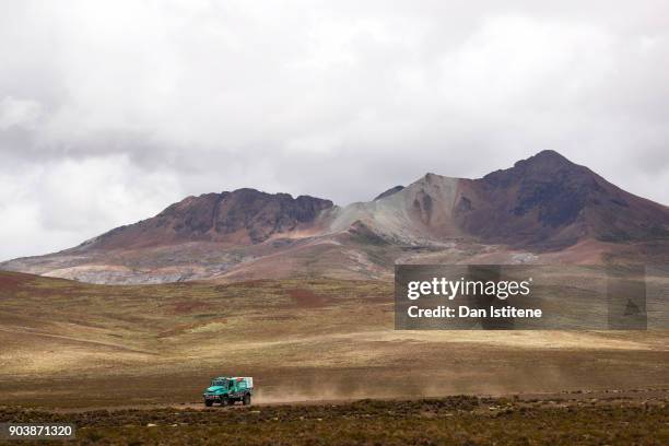 Ton Van Genugten of the Netherlands and Petronas Team De Rooy Iveco drives with co-driver Bernard Der Kinderen of the Netherlands and mechanic Peter...