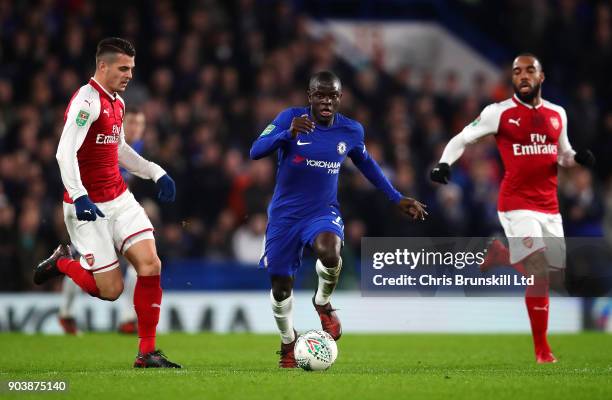 Golo Kante of Chelsea in action with Granit Xhaka of Arsenal during the Carabao Cup Semi-Final first leg match between Chelsea and Arsenal at...