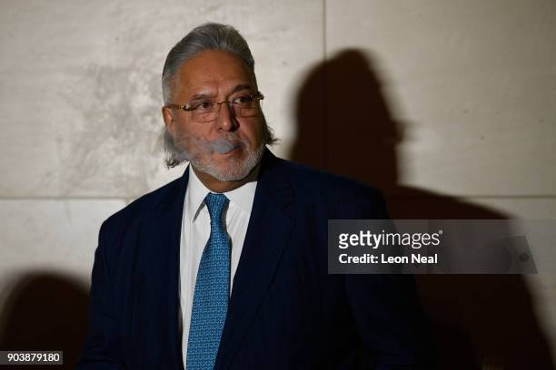 Force India team boss Vijay Mallya stands outside The City of Westminster Magistrates Court at the end of the day's proceedings, on January 11, 2018...