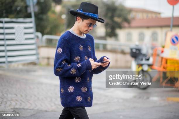 Alessandro Enriquez wearing blue hat, knit is seen during the 93. Pitti Immagine Uomo at Fortezza Da Basso on January 11, 2018 in Florence, Italy.
