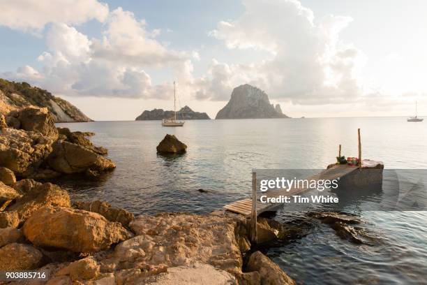cala d'hort beach, ibiza, spain - beach at cala d'or stock pictures, royalty-free photos & images