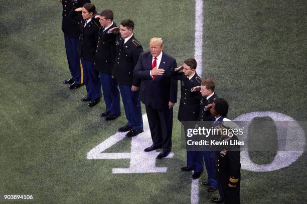 National Championship: Aerial view of United States President Donald J. Trump on field with hand on chest during anthem before Georgia vs Alabama...