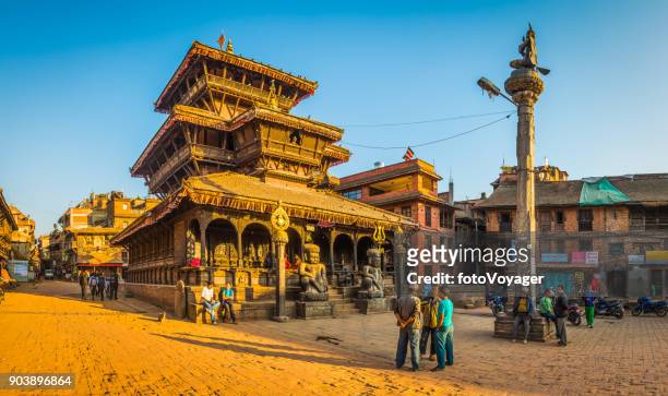 kathmandu sunset light illuminating ancient temples in bhaktapur panorama nepal - katmandu stock pictures, royalty-free photos & images