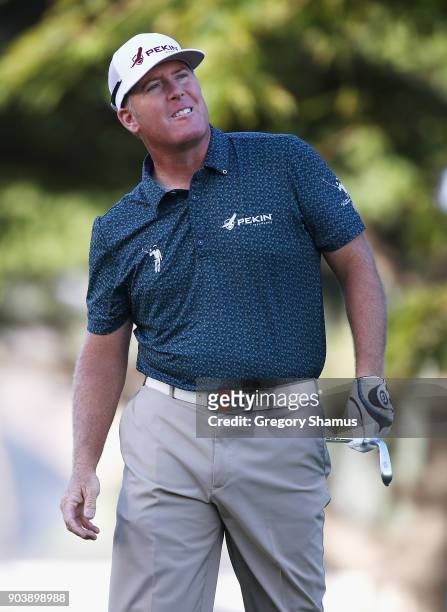 Points of the United States reacts to his shot from the fourth tee during round one of the Sony Open In Hawaii at Waialae Country Club on January 11,...