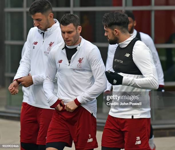 Marko Grujic, James Milner and Danny Ings of Liverpool during a training session at Melwood Training Ground on January 11, 2018 in Liverpool, England.