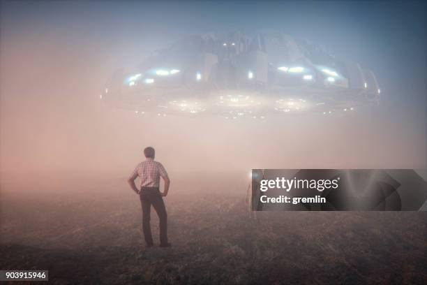 farmer meets alien - alien stock pictures, royalty-free photos & images