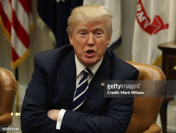 President Donald Trump leads a prison reform roundtable in the Roosevelt Room at the White House, on January 11, 2018 in Washington, DC. State and...