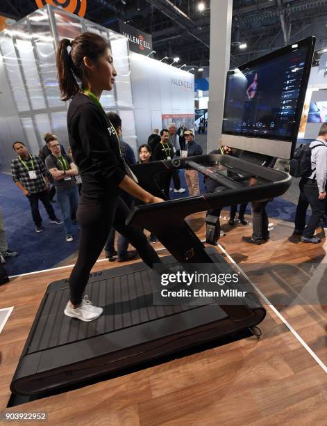 Maggie Lu uses a Peloton Tread treadmill during CES 2018 at the Las Vegas Convention Center on January 11, 2018 in Las Vegas, Nevada. The USD 3,995...