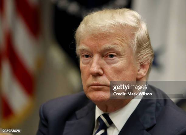 President Donald Trump leads a prison reform roundtable in the Roosevelt Room at the White House, on January 11, 2018 in Washington, DC. State and...