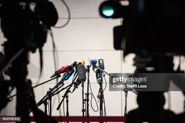 Cameras and microphones stand at the headquarters of the German Social Democrats where preliminary coalition talks will take place on January 11,...