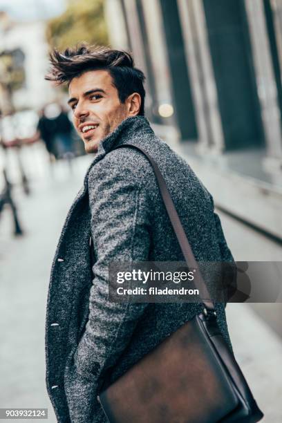 elegant man in the city - man looking back stock pictures, royalty-free photos & images