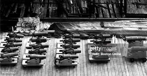 Cannon sit out for cleaning as the USS Constitution is repaired at dry dock in Boston, Aug. 27, 1992.