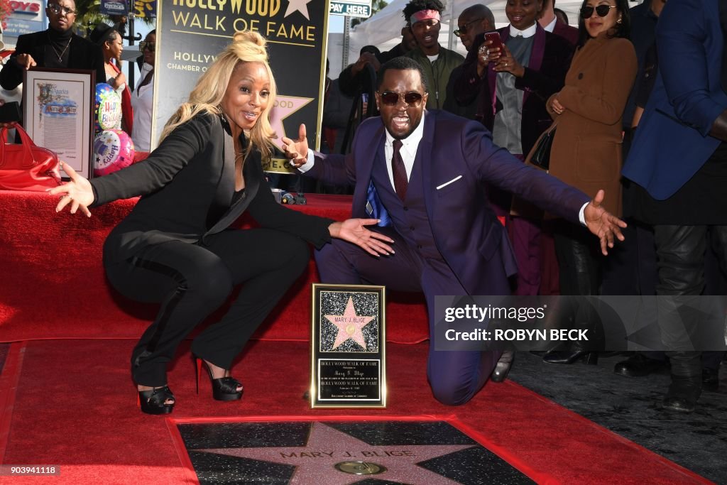 Recording artist Mary J. Blige is joined by Sean "Diddy" Combs as she... News Photo - Getty Images
