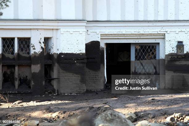 Mud line is visible on the side of a home that was destroyed by a mudslide on January 11, 2018 in Montecito, California. 17 people have died and...