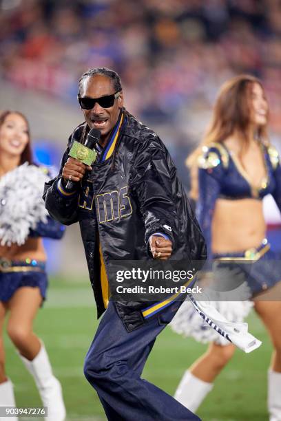 Playoffs: Rapper Snoop Dogg performing during halftime show during Los Angeles Rams vs Atlanta Falcons at Los Angeles Memorial Stadium. Los Angeles,...