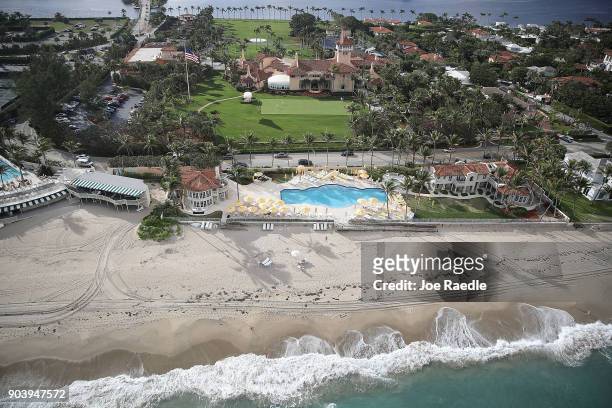 Waves from the Atlantic Ocean roll onto the beach adjacent to President Donald Trump's beach front Mar-a-Lago resort the day after Florida received...