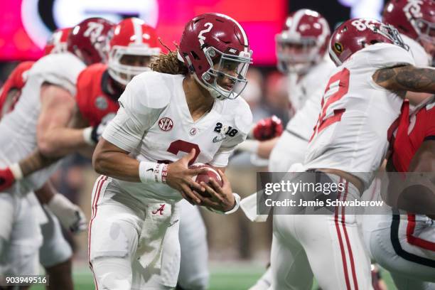 Jalen Hurts of the Alabama Crimson Tide rushes against the Georgia Bulldogs during the College Football Playoff National Championship held at...