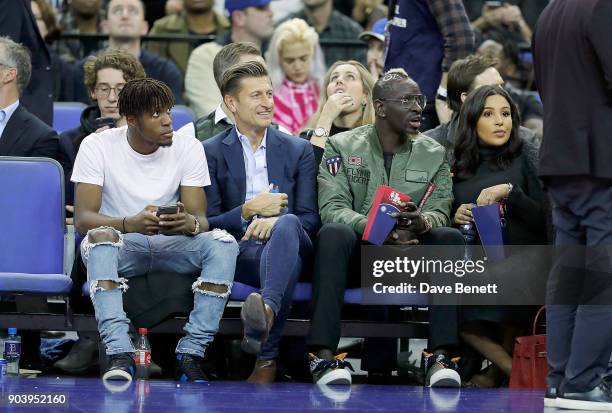 Wilfried Zaha, Steve Parish and Mamadou Sakho attend the Philadelphia 76ers and Boston Celtics London game at The O2 Arena on January 11, 2018 in...