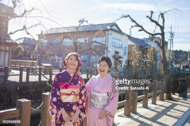happy mother and daughter on coming of age day - seijin no hi stock pictures, royalty-free photos & images