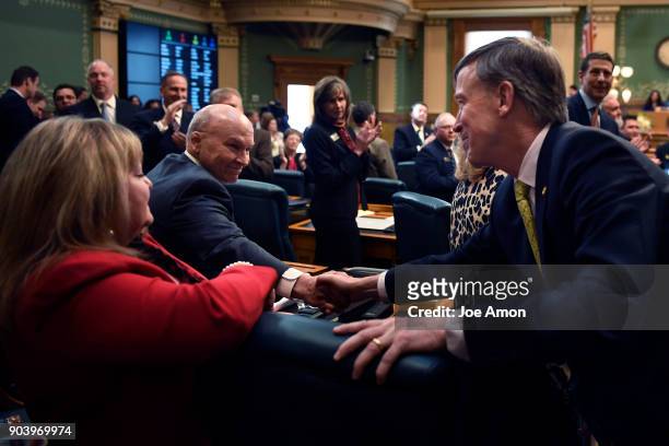 January 11: Governor John Hickenlooper shaking hands after delivering his last Colorado State of the State address at the Colorado State Capitol....