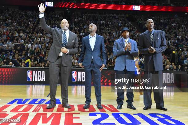 John Amaechi, Richard Hamilton, Andre Miller, and Robert Parish are seen during the game between the Philadelphia 76ers and Boston Celtics on January...