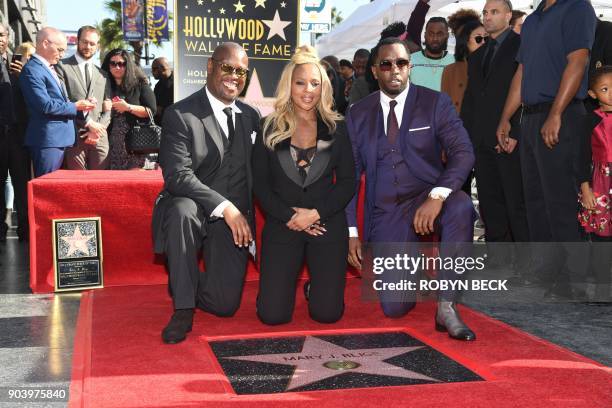 Recording artist Mary J. Blige is joined by music producers Andre Harrell and Sean 'Diddy' Combs as she is honored with a star on the Hollywood Walk...