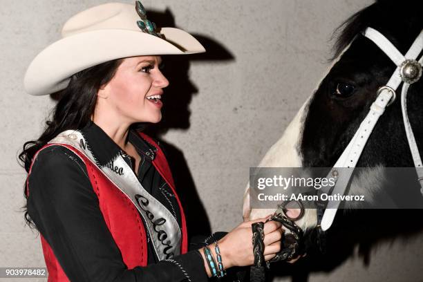 Miss Rodeo Colorado Alex Hyland, of Windsor, poses for a portrait with Miama the horse during the National Western Stock Show on Thursday, January...