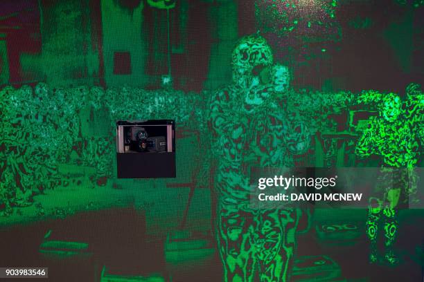 Thermal imaging cameras show a live image people people at the FLIR exhibit at CES in Las Vegas, Nevada, January 11, 2018. / AFP PHOTO / DAVID MCNEW