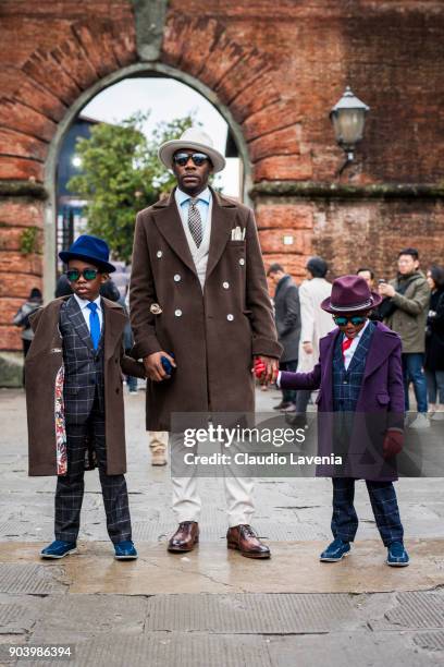 Father and his kids, wearing gentleman outfit, are seen during the 93. Pitti Immagine Uomo at Fortezza Da Basso on January 10, 2018 in Florence,...