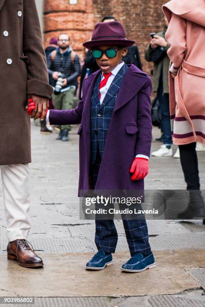 Kid, wearing gentleman outfit, is seen during the 93. Pitti Immagine Uomo at Fortezza Da Basso on January 10, 2018 in Florence, Italy.