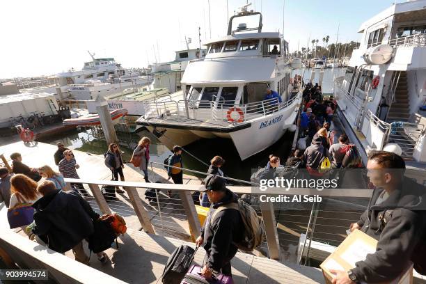 About 130 passengers depart on the Island Packers vessel Islander in Santa Barbara Harbor headed to Ventura as Island Packers and Condor Express from...