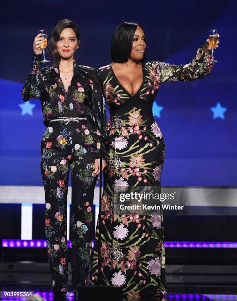 Host Olivia Munn and actor Niecy Nash speak onstage during The 23rd Annual Critics' Choice Awards at Barker Hangar on January 11, 2018 in Santa...