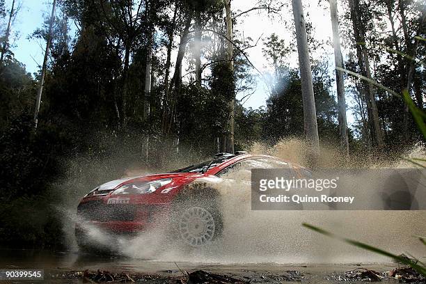 Conrad Rautenbach of Zimbabwe and Daniel Barritt of Great Britain compete in their Citroen C4 during the Repco Rally of Australia Special Stage 32 on...