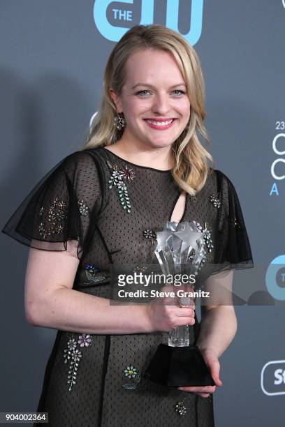 Actor Elisabeth Moss poses with the award for Best Actress in a Drama Series for 'The Handmaids Tale', in the press room during The 23rd Annual...