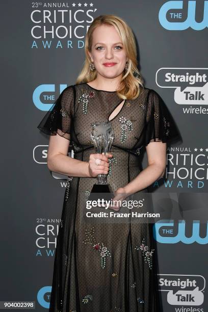 Actor Elisabeth Moss, winner of Best Actress in a Drama Series for 'The Handmaid's Tale', poses in the press room during The 23rd Annual Critics'...