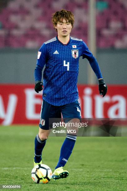 Ko Itakura of Japan and Michel Termanini of Palestine compete for the ball during the AFC U-23 Championship Group B match between Japan and Palestine...