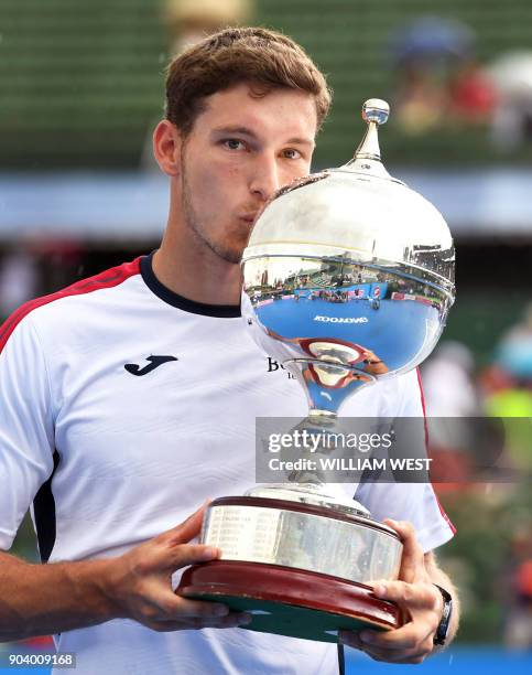 Pablo Carreno Busta of Spain kisses the trophy after defeating Matthew Ebden of Australia in the final of the Kooyong Classic tennis tournament in...