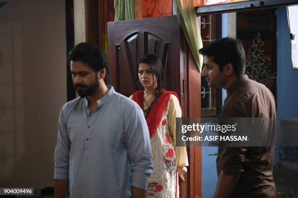 This photograph taken on October 18 shows Pakistani actress Fatima Shah Jeelani and actors Ali Abbas and Imran Ashraf filming the drama serial 'Mein...