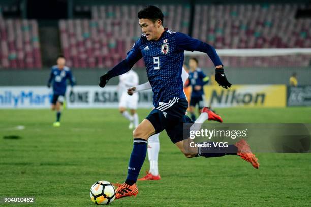 Kyosuke Tagawa of Japan drives the ball during the AFC U-23 Championship Group B match between Japan and Palestine at Jiangyin Sports Center on...