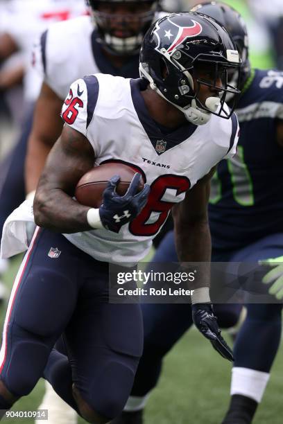 Lamar Miller of the Houston Texans runs with the ball during the game against the Seattle Seahawks at CenturyLink Field on October 29, 2017 in...